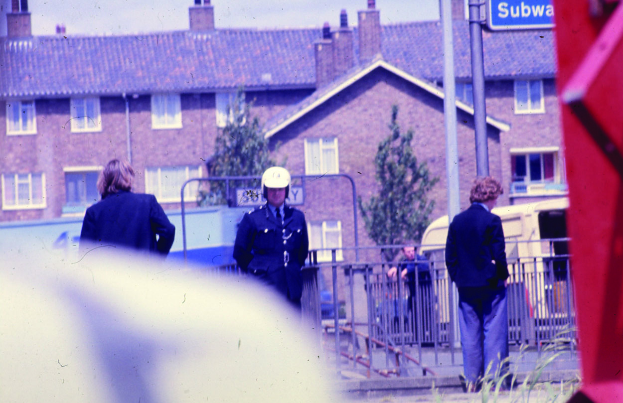 Policeman by a fence