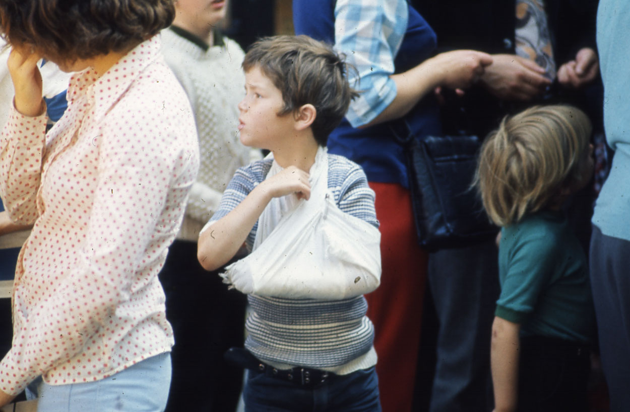 A kid lost in the crowd.